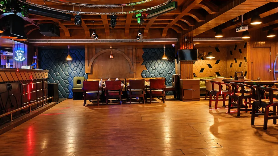 The BAR CODE lounge and dance floor under warm pendant lights.